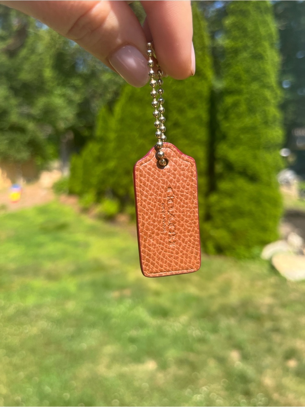 COACH Pebbled Leather Hang Tag, Brown